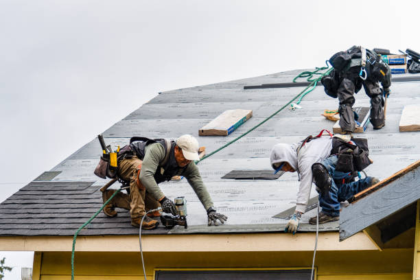 Professional Roofing technician working in Bourbon, IN
